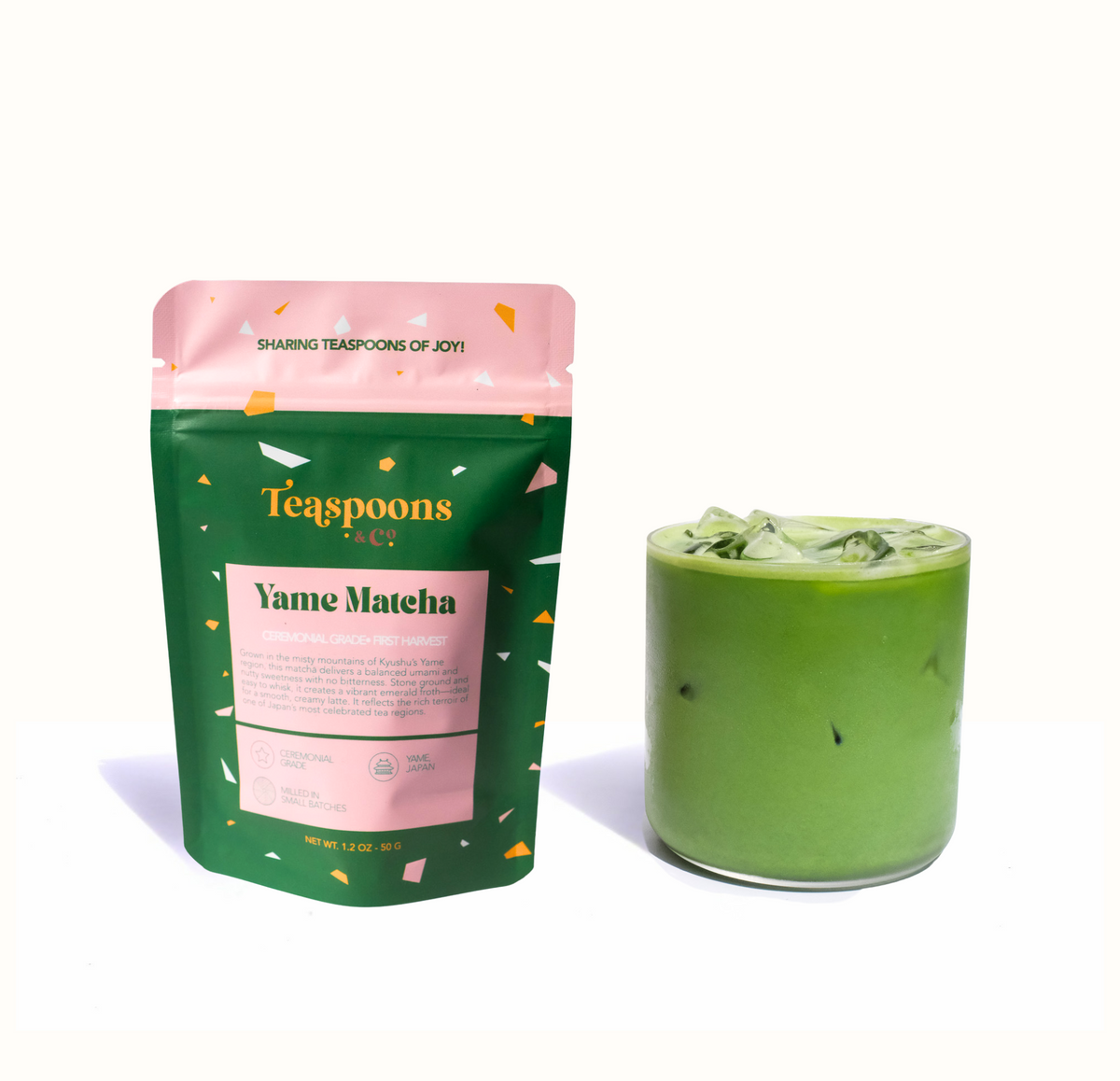 Tea package labeled 'Yame Matcha' next to a glass of green tea on a white background